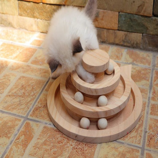 cat playing with three tier toy
