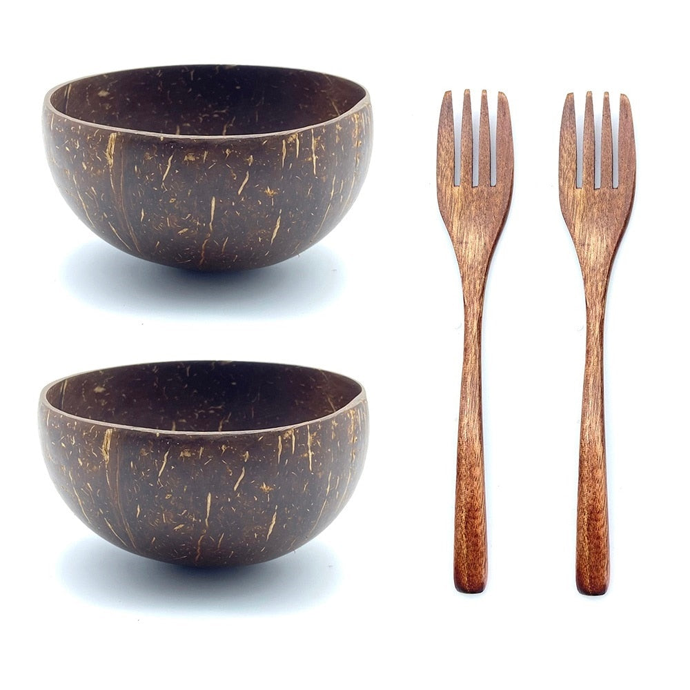 two coconut bowls with two wood forks