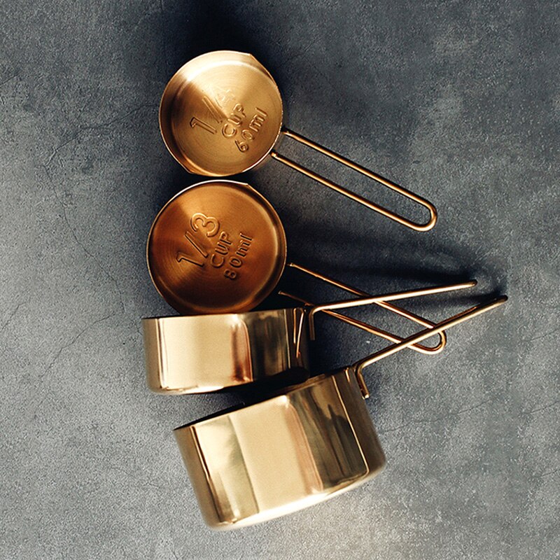 separated set of gold measuring cups
