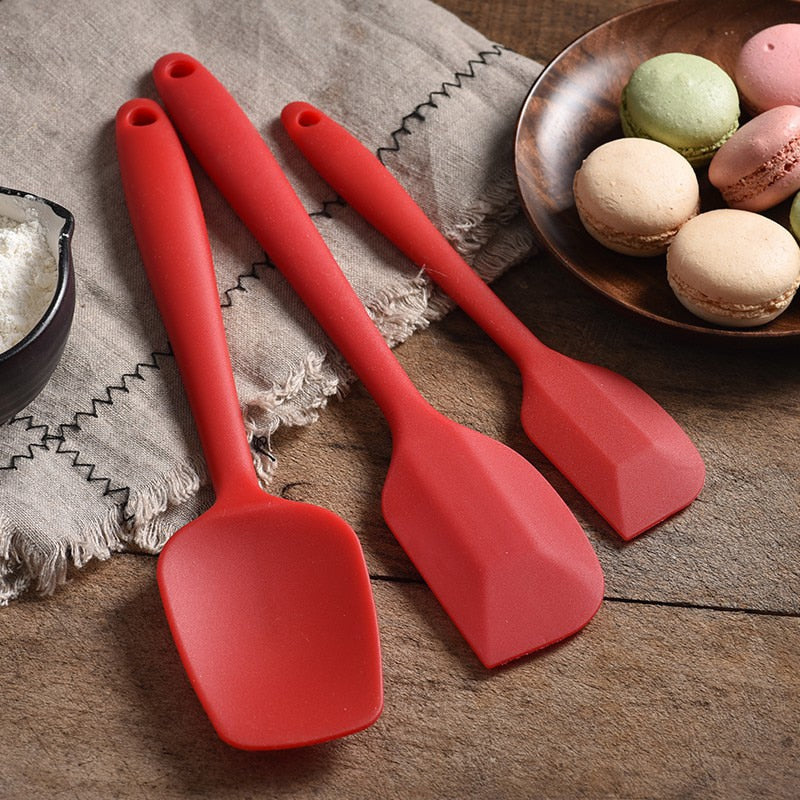 set of red spatulas on counter